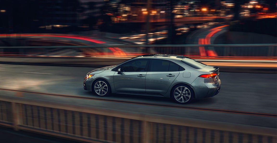 Bennett Toyota of Allentown is a Car Dealership near Reading, PA | 2020 Toyota Corolla driving on a bridge at night