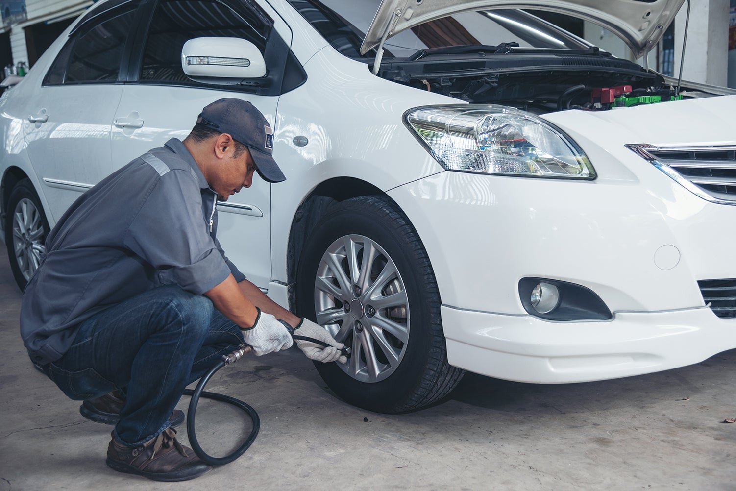 How to check your tires' health at Bennett Toyota of Allentown | Service technician checking tire pressure