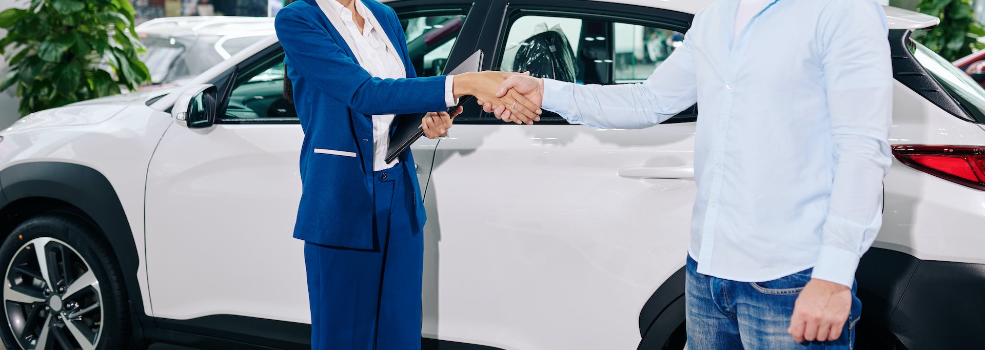Documents to bring when purchasing a car at Bennett Toyota in Allentown | Customer making a deal with Toyota finance advisor