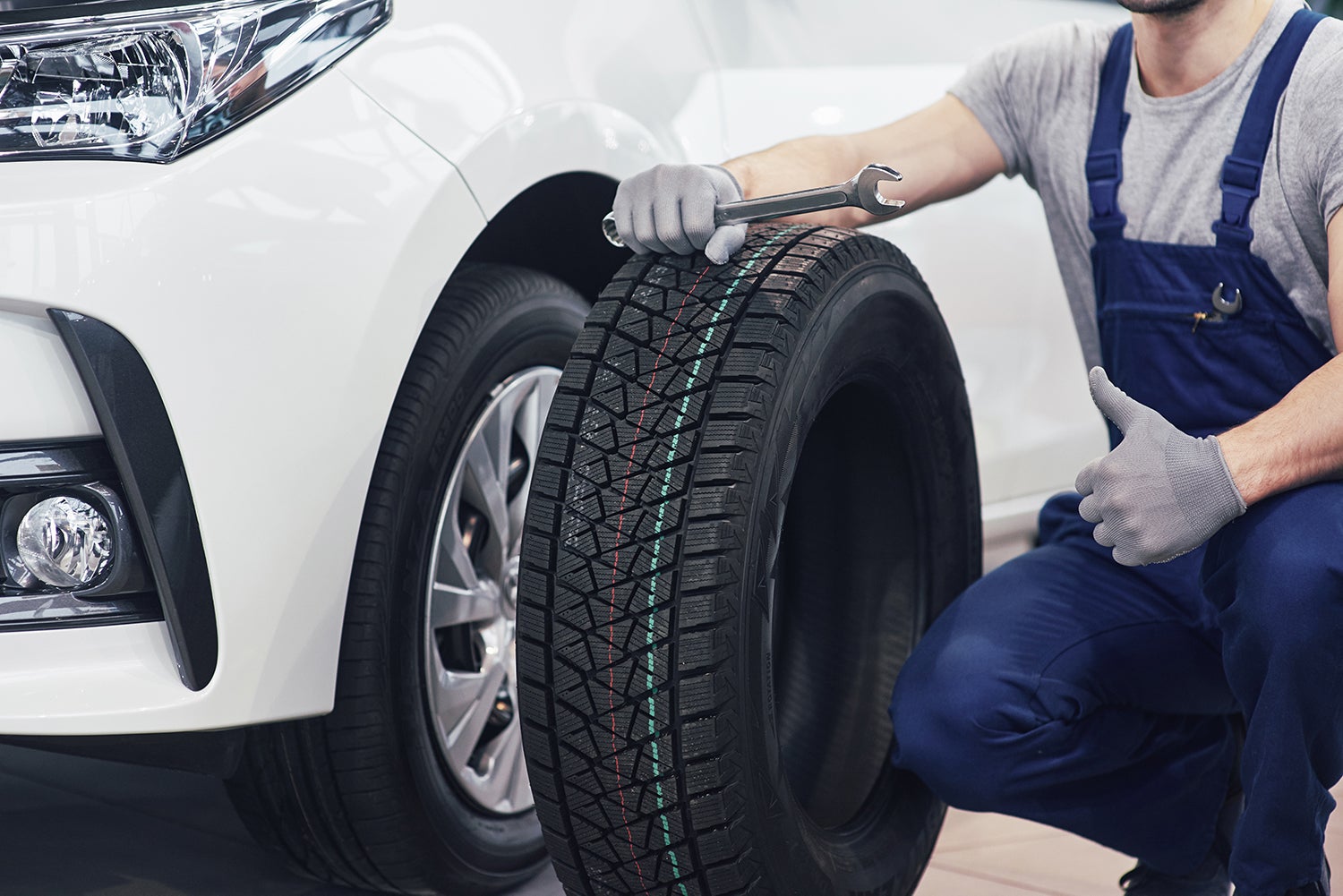 How to check your tires' health at Bennett Toyota of Allentown | Service technician with a brand new tire