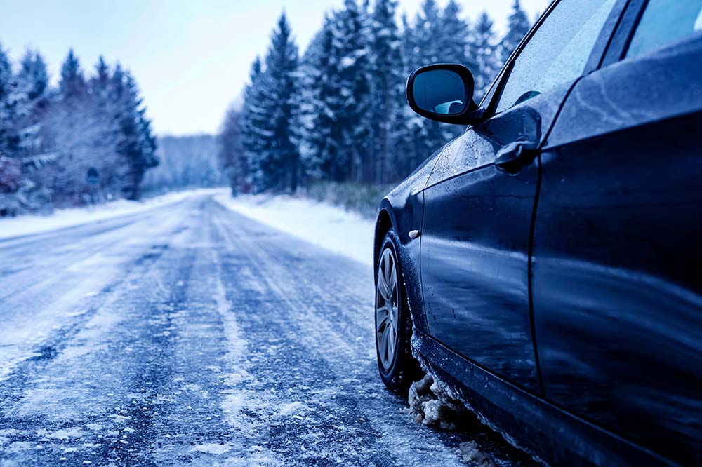Winter Tires vs. All Season Tires at Bennett Toyota in Allentown, PA | Car driving on snow covered road in winter